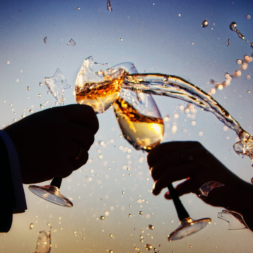 breaking champaigne glasses during a toast